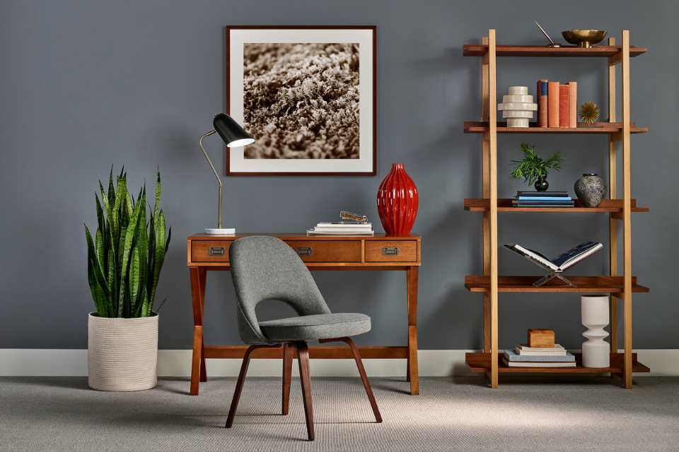 home office with wall painted grey and beige carpet